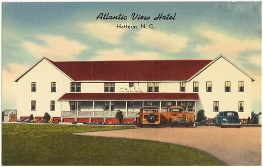 Historic postcard of the Atlantic View Hotel in Hatteras, North Carolina, featuring vintage cars and a two-story building.